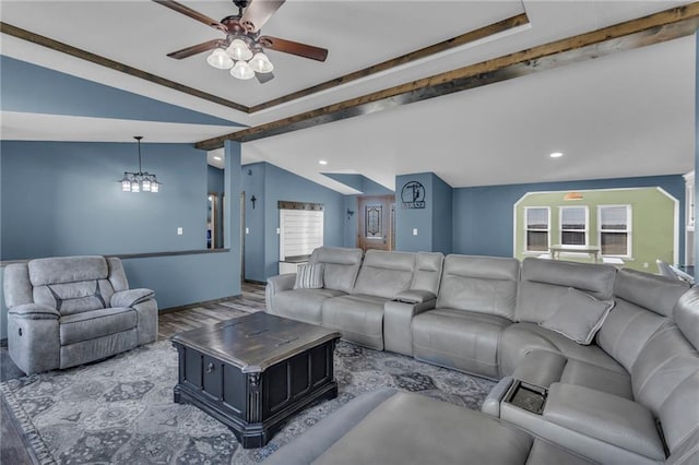 living area with lofted ceiling with beams, recessed lighting, wood finished floors, and ceiling fan with notable chandelier