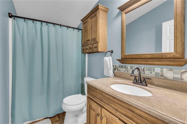 full bathroom with vanity, toilet, and a shower with curtain