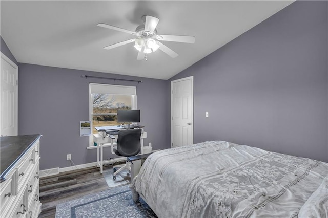 bedroom with ceiling fan, baseboards, vaulted ceiling, and dark wood-style flooring