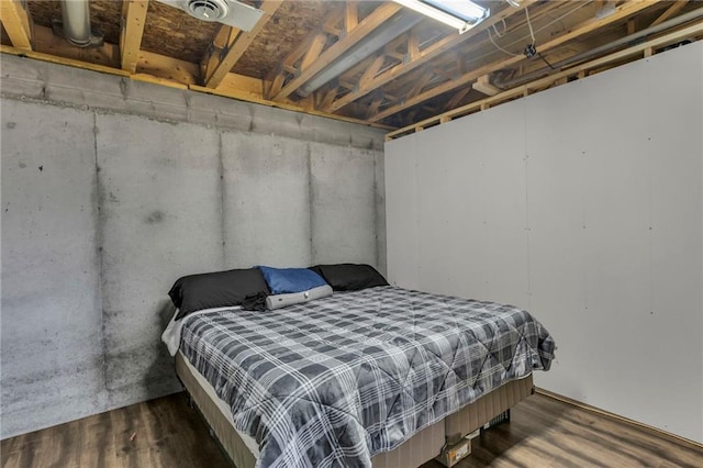 bedroom featuring a closet and wood finished floors