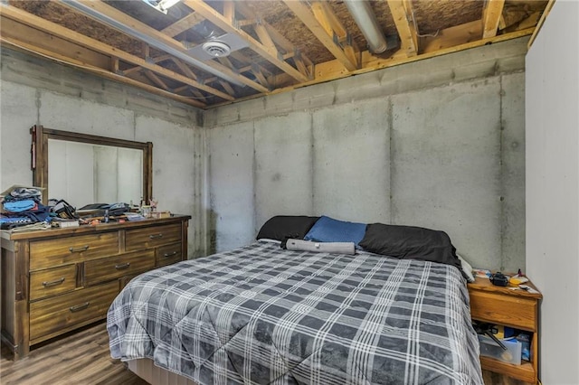 bedroom with wood finished floors