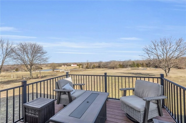 wooden terrace featuring a rural view