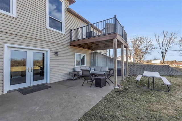 view of patio / terrace with french doors and an outdoor living space