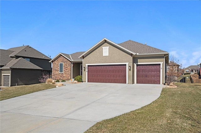 view of front of house with roof with shingles, driveway, an attached garage, stucco siding, and a front lawn