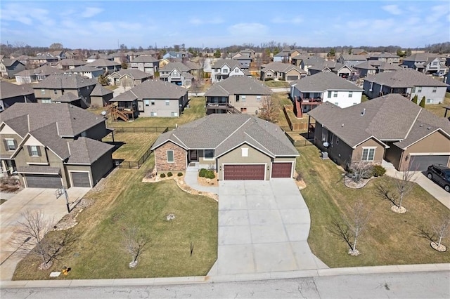 birds eye view of property with a residential view