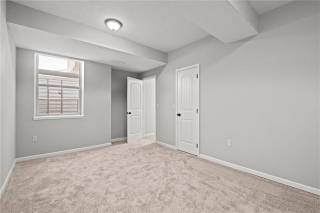 interior space featuring baseboards and a textured ceiling