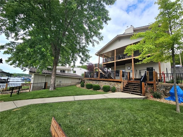 view of yard featuring fence, stairway, and a wooden deck