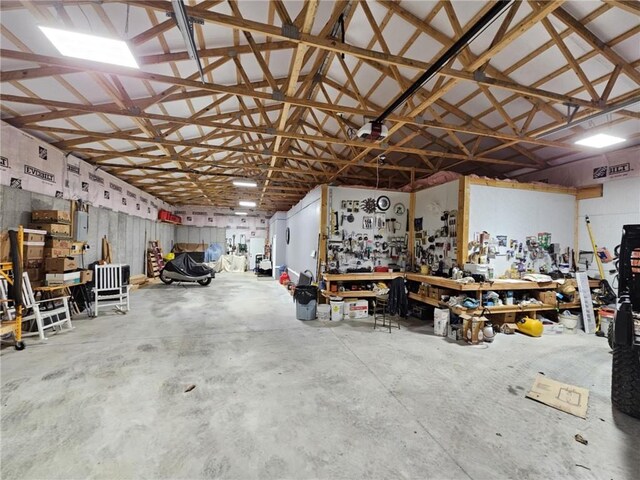 garage with metal wall and a workshop area