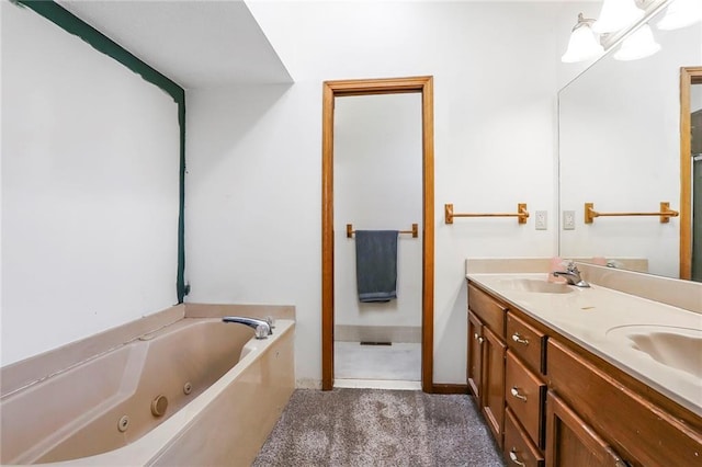 full bath with a sink, double vanity, and a whirlpool tub