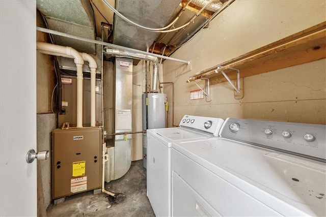 laundry area with laundry area, gas water heater, and washing machine and clothes dryer