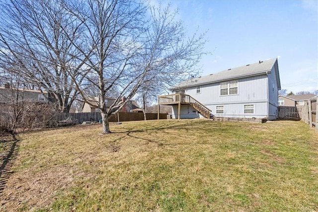 view of yard with a fenced backyard, stairway, and a deck