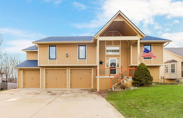 view of front of house featuring concrete driveway, a front lawn, roof with shingles, and an attached garage