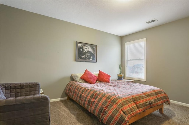 bedroom with carpet, visible vents, and baseboards