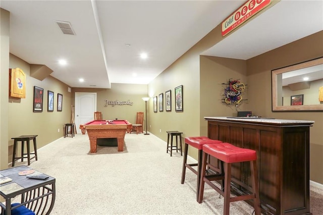 playroom with a dry bar, baseboards, light carpet, and visible vents