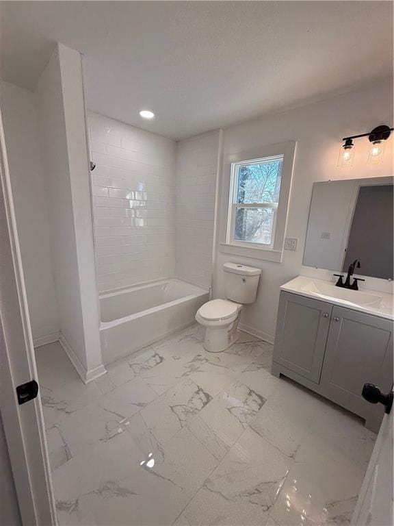 full bathroom featuring shower / bath combination, baseboards, toilet, marble finish floor, and vanity