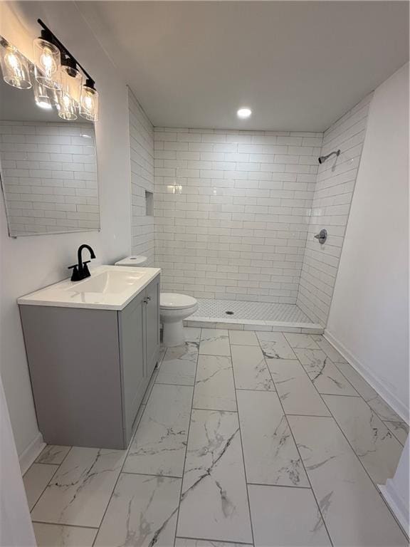 full bathroom with a stall shower, marble finish floor, toilet, and baseboards