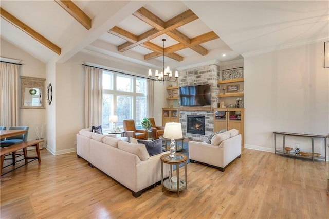 living room featuring light wood-type flooring, a fireplace, and beam ceiling