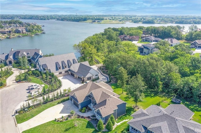 birds eye view of property featuring a residential view and a water view