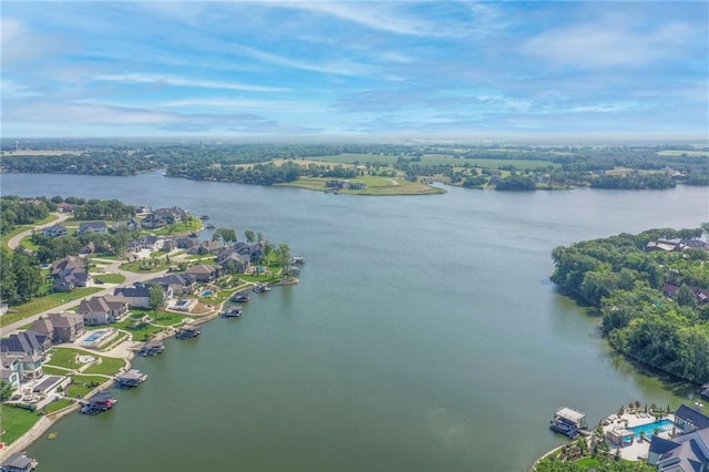 drone / aerial view featuring a residential view and a water view