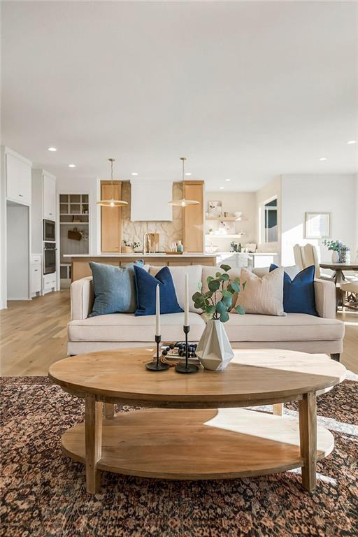 living room featuring recessed lighting and light wood-style flooring