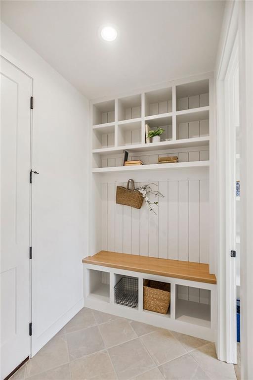 mudroom featuring recessed lighting and light tile patterned flooring