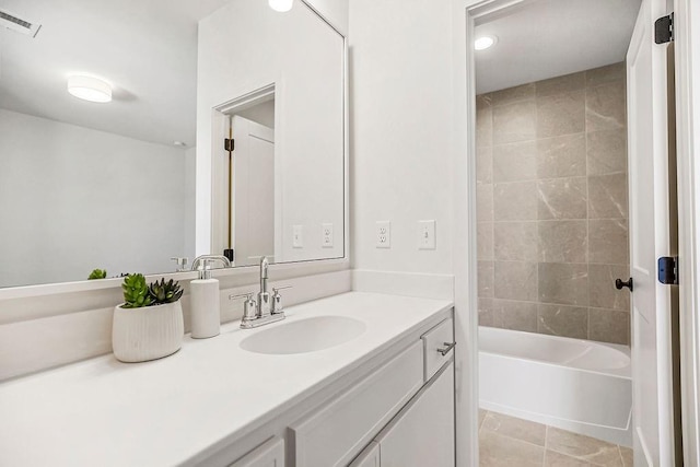 full bath with tile patterned flooring, visible vents, vanity, and bathtub / shower combination