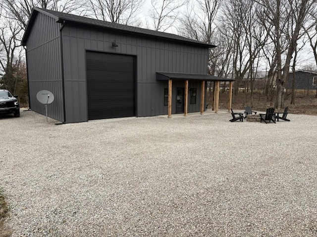 view of outbuilding with an outdoor fire pit