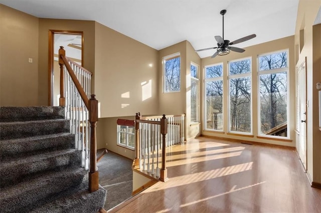 sunroom / solarium with visible vents and a ceiling fan