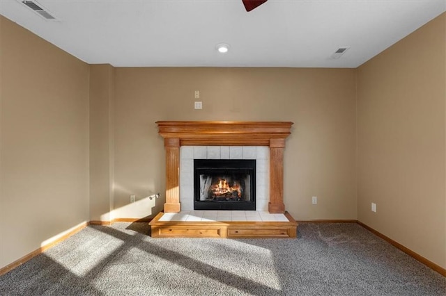 interior details with carpet floors, baseboards, a fireplace, and visible vents