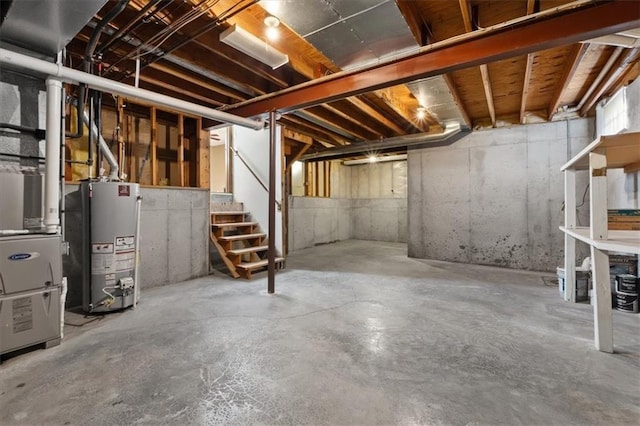 unfinished below grade area with gas water heater and stairway