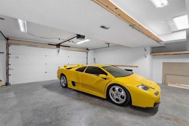 parking garage featuring a garage door opener