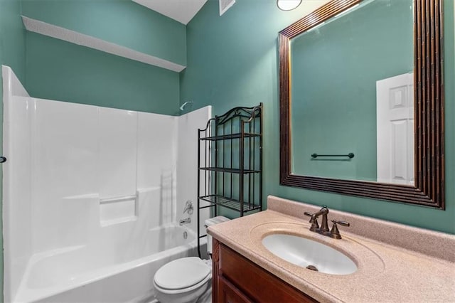 bathroom featuring bathtub / shower combination, vanity, and toilet