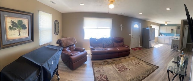 living area with light wood finished floors, visible vents, baseboards, ceiling fan, and recessed lighting