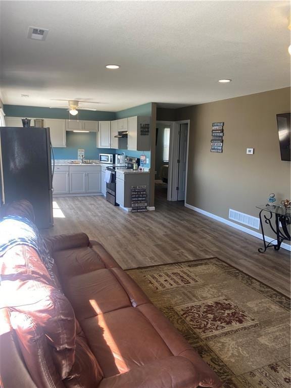 200 Ramsey Dr, Craig, MO 64437 - living area featuring recessed lighting, wood finished floors, visible vents, and baseboards
