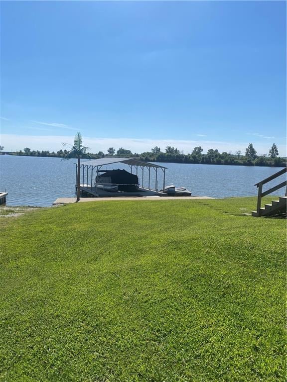 200 Ramsey Dr, Craig, MO 64437 - dock area with a water view and a lawn