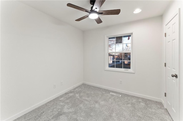 carpeted spare room featuring recessed lighting, ceiling fan, and baseboards