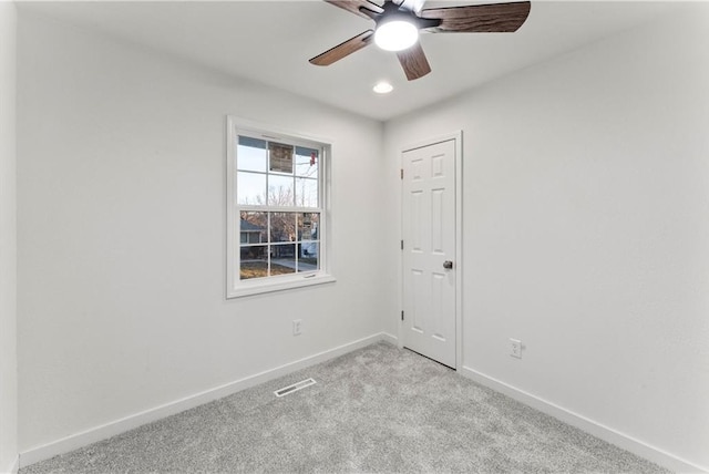 empty room with light carpet, visible vents, baseboards, ceiling fan, and recessed lighting