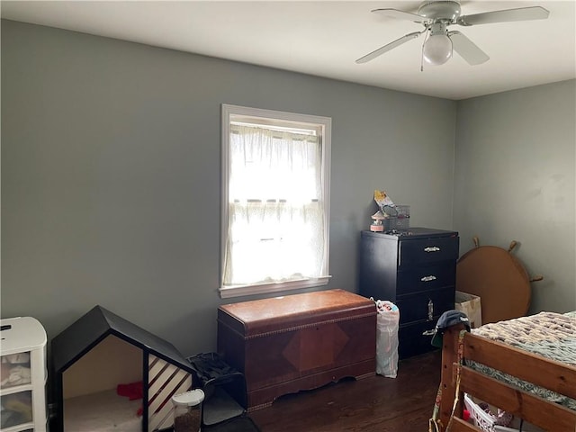 bedroom featuring dark wood-style floors and a ceiling fan