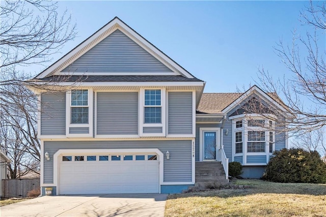 view of front facade featuring a garage, fence, concrete driveway, and a front yard