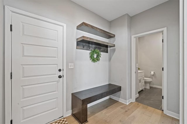 mudroom featuring light wood-type flooring and baseboards