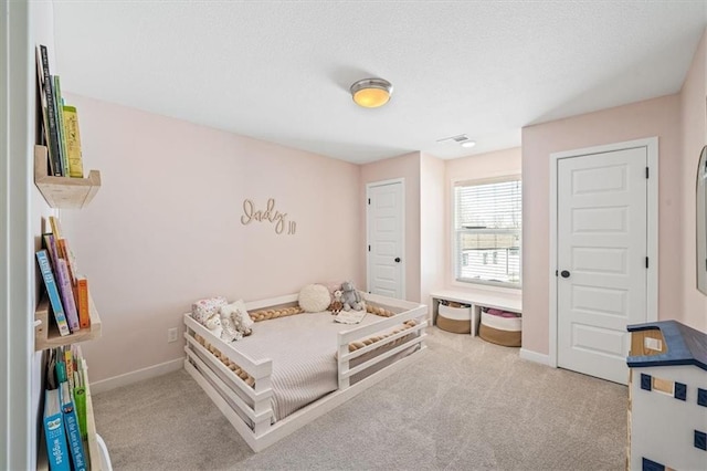 carpeted bedroom with baseboards