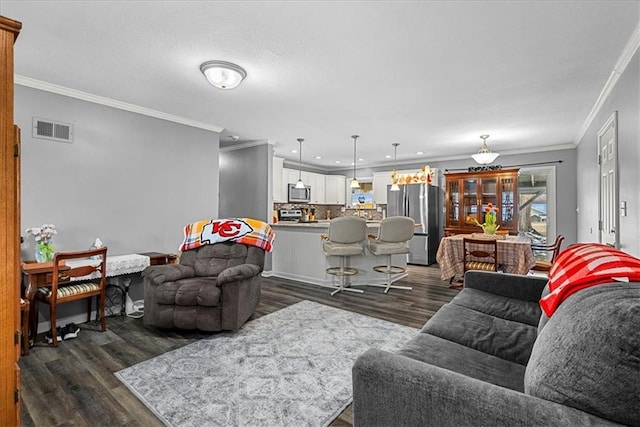 living room featuring crown molding, visible vents, dark wood-type flooring, and recessed lighting