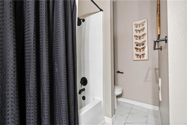 bathroom with marble finish floor, toilet, baseboards, and shower / bath combo with shower curtain