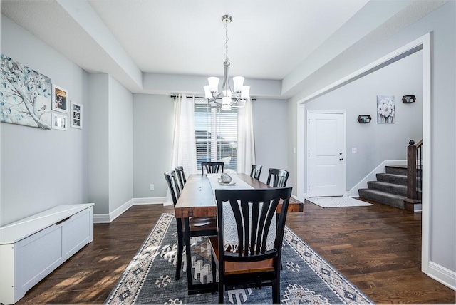 dining space with stairs, baseboards, dark wood finished floors, and an inviting chandelier