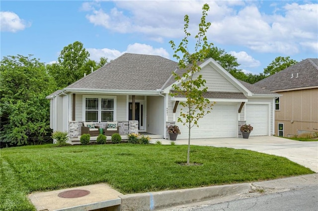 view of front facade featuring a porch, a garage, concrete driveway, roof with shingles, and a front yard