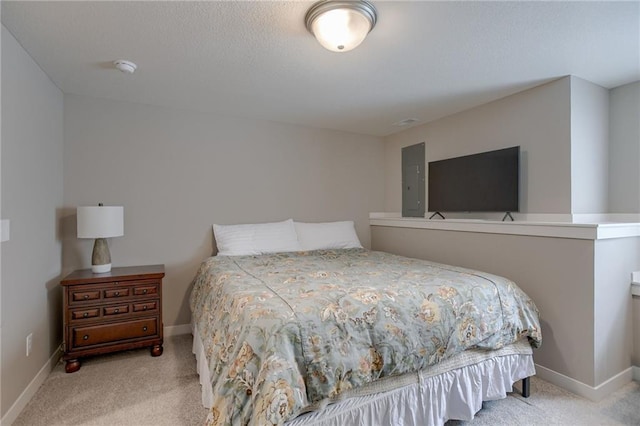 bedroom with baseboards and light colored carpet