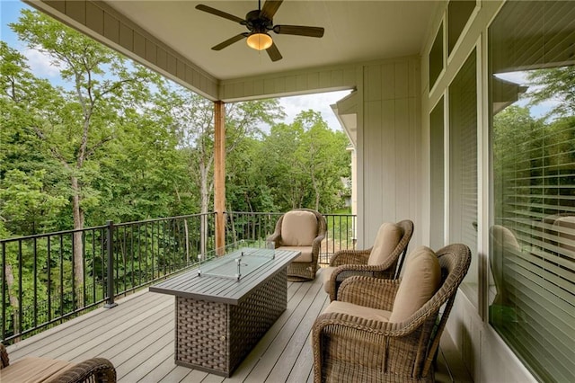 deck featuring outdoor lounge area and ceiling fan