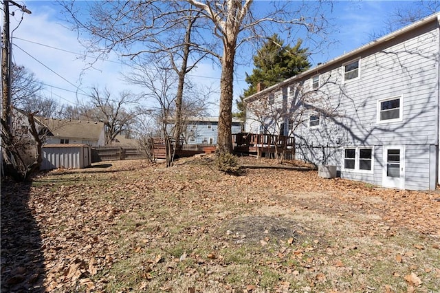 view of yard with fence and a wooden deck