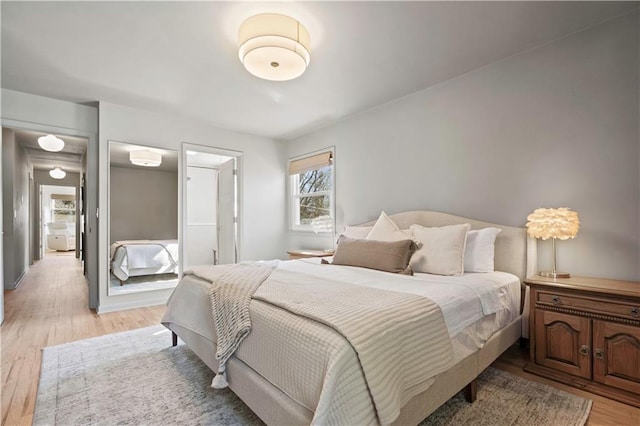 bedroom featuring light wood-style floors