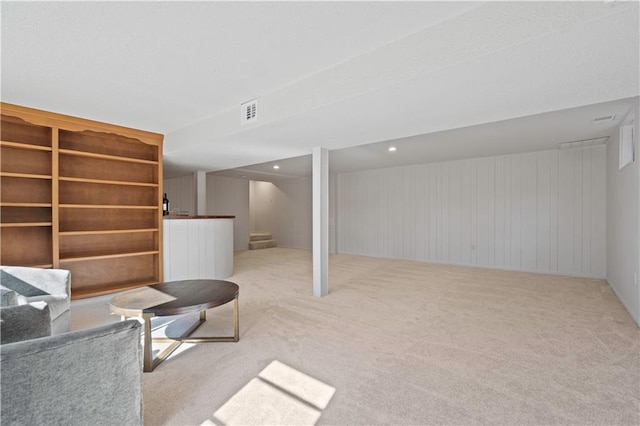 unfurnished living room featuring visible vents, carpet flooring, and recessed lighting